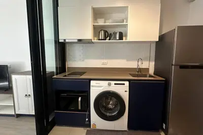 a kitchen with a washing machine and a sink at The Base Central Phuket-C4YW in Phuket Town
