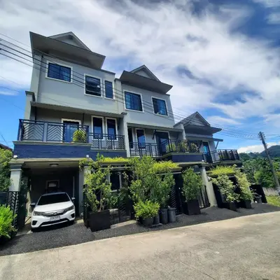 a white car parked in front of a house at Naiharn high view villa in Rawai Beach