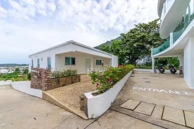 a villa with a view of a building at Apartment Kata Ocean View in Kata Beach