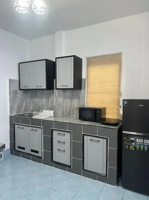 a kitchen with a counter top with a microwave at P&I Group Home 4 Karon beach in Karon Beach