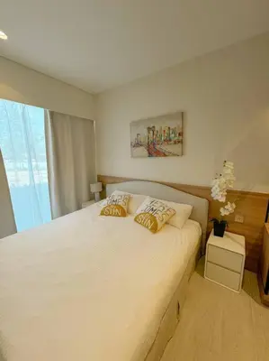 a bedroom with a large white bed with two pillows at New apartment 2bedrooms in Laguna lakeside Bang Tao beach in Phuket