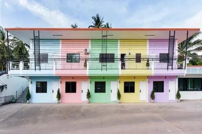 a building painted in different colors at Songbird Suites in Ban Khlong Haeng