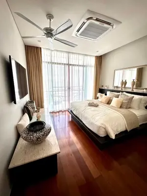a bedroom with a large bed and a ceiling fan at Sea view Villa on Rawai beach in Ban Saiyuan (1)