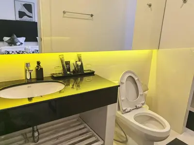 a bathroom with a sink and a toilet and a mirror at little princess \u5c0f\u516c\u4e3b\u522b\u5885 in Patong Beach