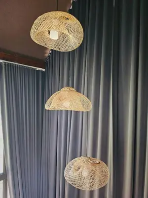 three lights hanging from the ceiling in front of a curtain at Cheewatra Farmstay Phuket ชีวาตรา ฟาร์มสเตย์ ภูเก็ต in Thalang