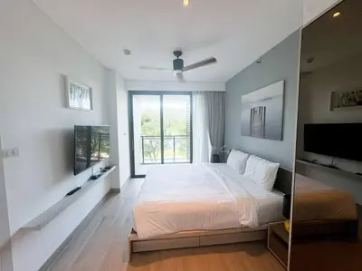 a bedroom with a large bed and a window at 2bedrooms Cassia Residence lake view in Phuket