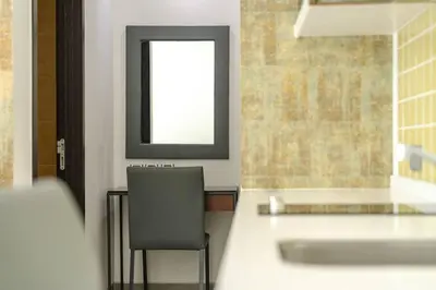a bathroom with a chair and a sink at Minuets 2 Patong Beach Twin Sand Resort & Spa! C152 in Patong Beach