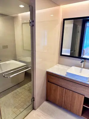 a bathroom with a sink and a mirror and a tub at New stylish studio in La Vita 5 in Rawai Beach