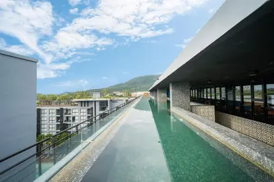 a view from the roof of a building with a swimming pool at Citygate Kamala Resort in Kamala Beach