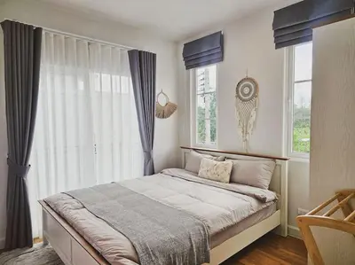a bedroom with a bed and a large window at Little Cottage - 3BR House for family vacation By Little Latte House in Ban Pa Khlok