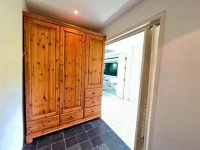 a room with a wooden cabinet and a doorway at 30 - Panoramic View Villa in Thalang in Thalang