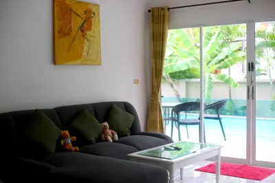 a living room with a couch and a glass table at 3 bedrooms Semi-Detached with Pool near Kamala Beach in Kamala Beach