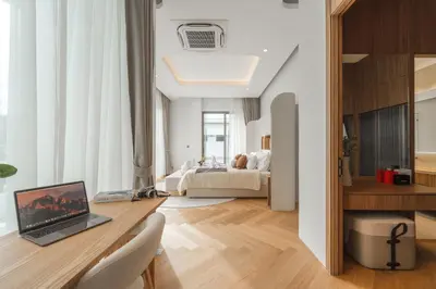 a room with a desk with a laptop on it at Nature's Rest Private Pool Villa Rawai in Phuket Town