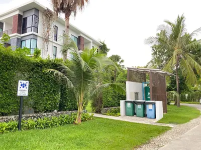 a building with four trash cans in front of it at Pond View apartment Title Rawai by Clavis in Rawai Beach