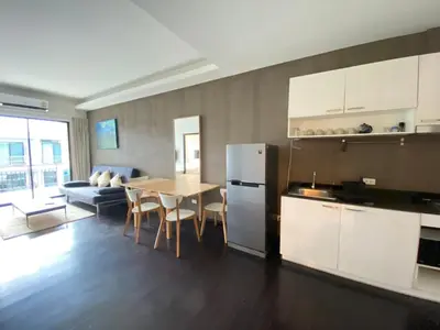 a kitchen and living room with a table and a refrigerator at Pond View apartment Title Rawai by Clavis in Rawai Beach
