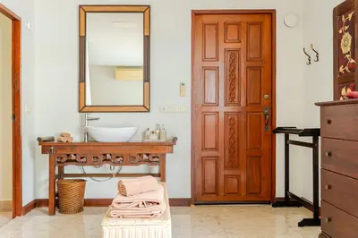 a bathroom with a sink and a mirror at Luxury 4BR Villa with Pool & Ocean Views on Patong in Patong Beach
