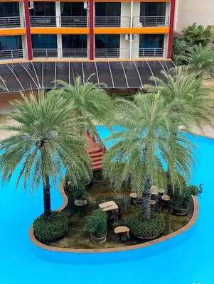 a model of a hotel with palm trees and tables at Sunset Room Phuket in Ban Mai Salae