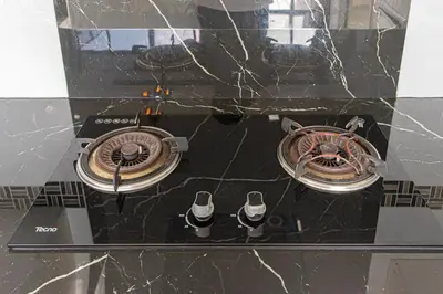 a glass table with two burners on top of it at Kathu V pool villa 171 in Kathu