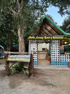 a bench sitting in front of a building at Alanta aonang resort in Ban Khlong Haeng