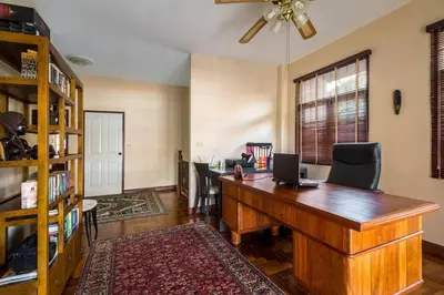 an office with a desk with a laptop on it at Luxury Pool Villa by Golf Courses & Elephant Sanctuary in Kathu