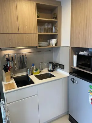 a white kitchen with a sink and a microwave at Studio Apartment, Bang Tao Phuket in Laguna Phuket