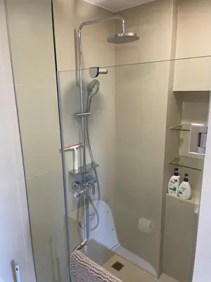 a shower stall with a toilet in a bathroom at Studio Apartment, Bang Tao Phuket in Laguna Phuket