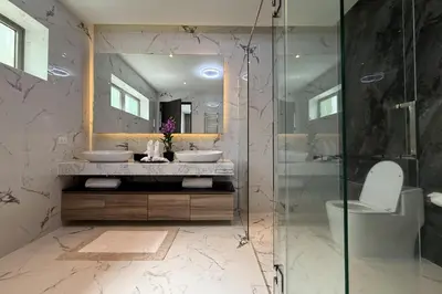 a bathroom with two sinks and a shower at Villa Lion Phuket in Phuket