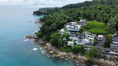 an aerial view of a house on a hill next to the water at Luxury Seaview 6 Bedrooms with Infinity Pool Villa, private Gym, Superfast WIFI in Surin Beach