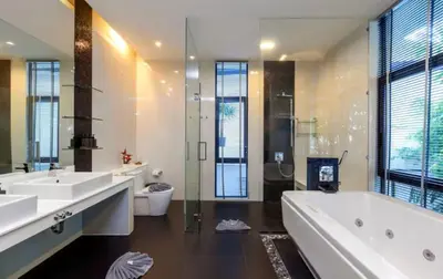 a bathroom with two sinks and a tub and a toilet at 15 - Ocean View Oasis in Kalim Beach in Patong Beach