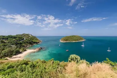 an island in the ocean with boats in the water at West facing 3br Boutique Pool Villa in Phuket Town