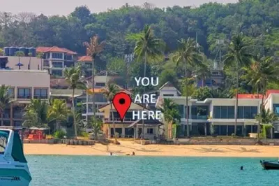 a sign that says you are here on a beach at Beach Front Sand Castle - kid friendly right on the perfect beach in Ban Ao Makham