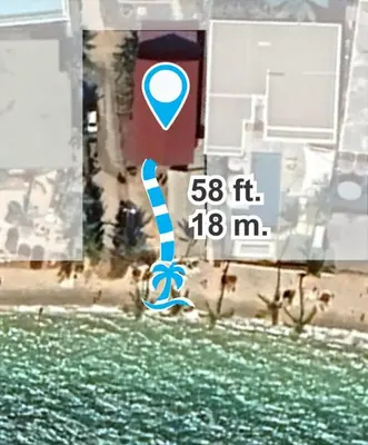 a picture of a sign with a pair of shoes at Beach Front Sand Castle - kid friendly right on the perfect beach in Ban Ao Makham
