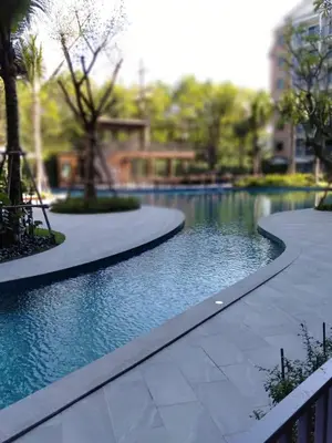 a swimming pool in the middle of a park at Title Residencies Naiyang 2 Bedrooms PoolAccess in Nai Yang Beach
