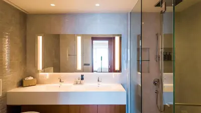 a bathroom with two sinks and a shower at Laguna Seaview Penthouse with Rooftop Pool 50 m to Bang Tao Beach in Bang Tao Beach
