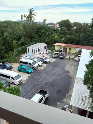 an aerial view of a parking lot with cars at Little Sweet Home in Phuket Town