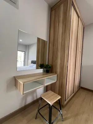 a dressing room with a mirror and a stool at Nub-Nueng place นับหนึ่ง เพลส in Ban Bo Han