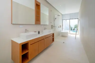 a bathroom with two sinks and a mirror at Brand-New & Luxury 5BR Pool Villa Trinity C2 in Bang Tao Beach