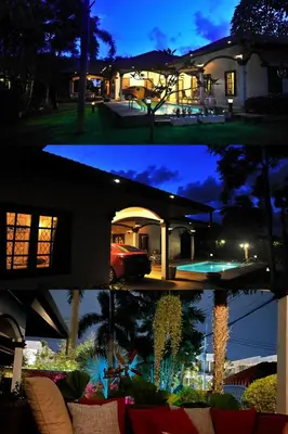 two pictures of a house at night and a house at Kesorn Charming Authentic Thai Pool Villa Phuket in Rawai Beach