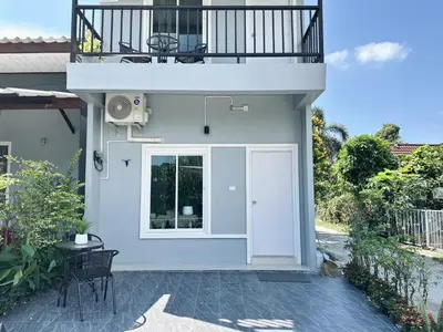 a house with a balcony and a patio at Sachi House Stay Near Muay Thai Gym and Beach in Ban Thalat Choeng Thale