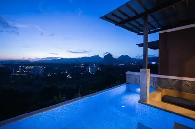 a villa with a swimming pool at night at Sea & Mountain View Private Pool Villa at Aonang Beach in Krabi town