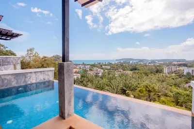a view from the balcony of a house with a swimming pool at Sea & Mountain View Private Pool Villa at Aonang Beach in Krabi town