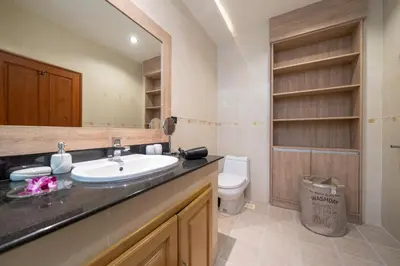 a bathroom with a sink and a toilet at Villa Conhei in Rawai Beach