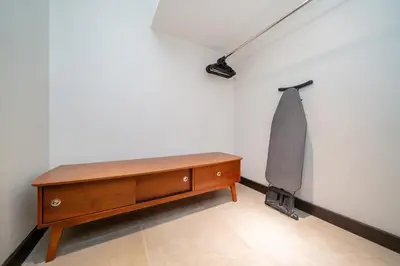 a room with a dresser and a lamp on a wall at Luxurious Villa Near Bangtao Beach in Bang Tao Beach
