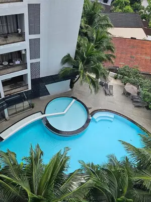 an overhead view of a large blue swimming pool at Penthouse Seaview poolview 140sqm panoramic B43 in Kamala Beach