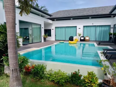 a swimming pool in the backyard of a house at Villa Destiny AZ in Ban Saiyuan (1)