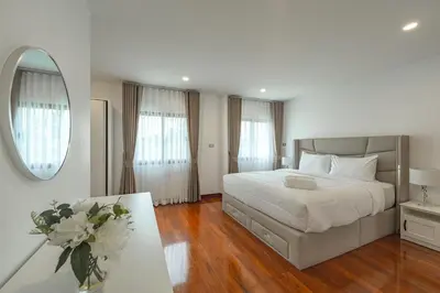 a white bedroom with a large bed and a mirror at V154 Built December 2024 Oasis Great Villa Beautiful in Chalong