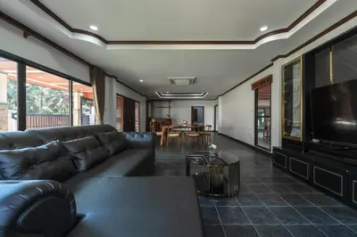 a living room with a couch and a flat screen tv at V155 4BR Large Family Villa Chalong in Chalong