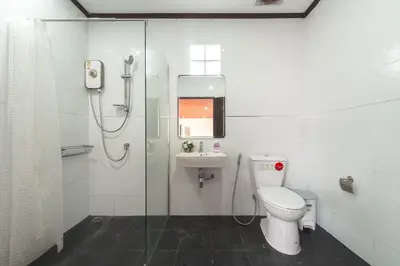 a bathroom with a shower and a toilet and a sink at V155 4BR Large Family Villa Chalong in Chalong
