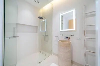 a bathroom with a shower and a glass door at Exclusive New Build - Designer 3BR Pool Villa in Prestigious LuxPride 4 L7 Residence in Bang Tao Beach