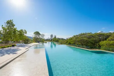 a view of a river with blue water at Laguna Beachside residences apartamens, walking distance to the sea in Bang Tao Beach